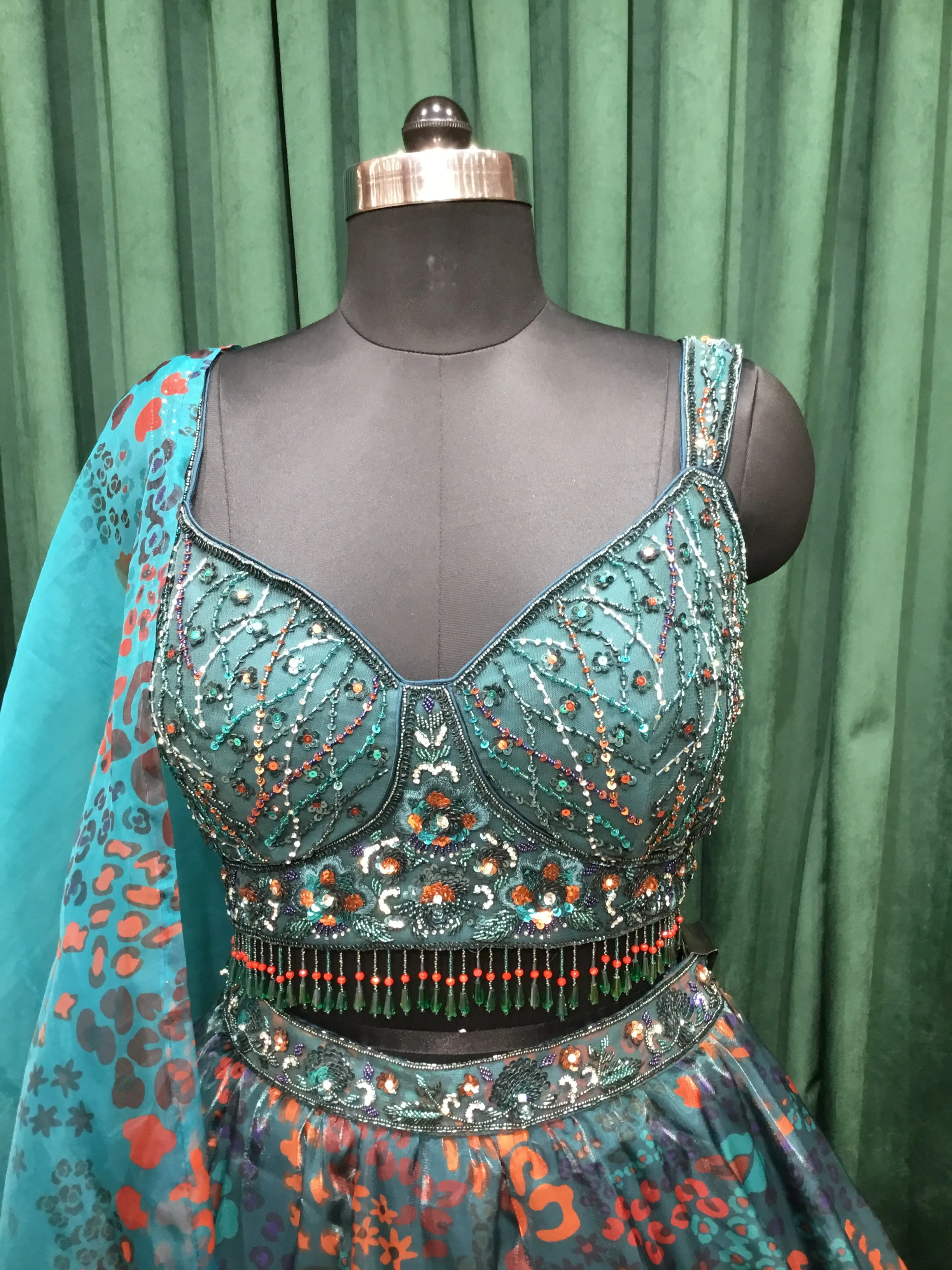 Bottle Green Organza Lehenga Print With Sequins, Jarkan, and Cut Dana